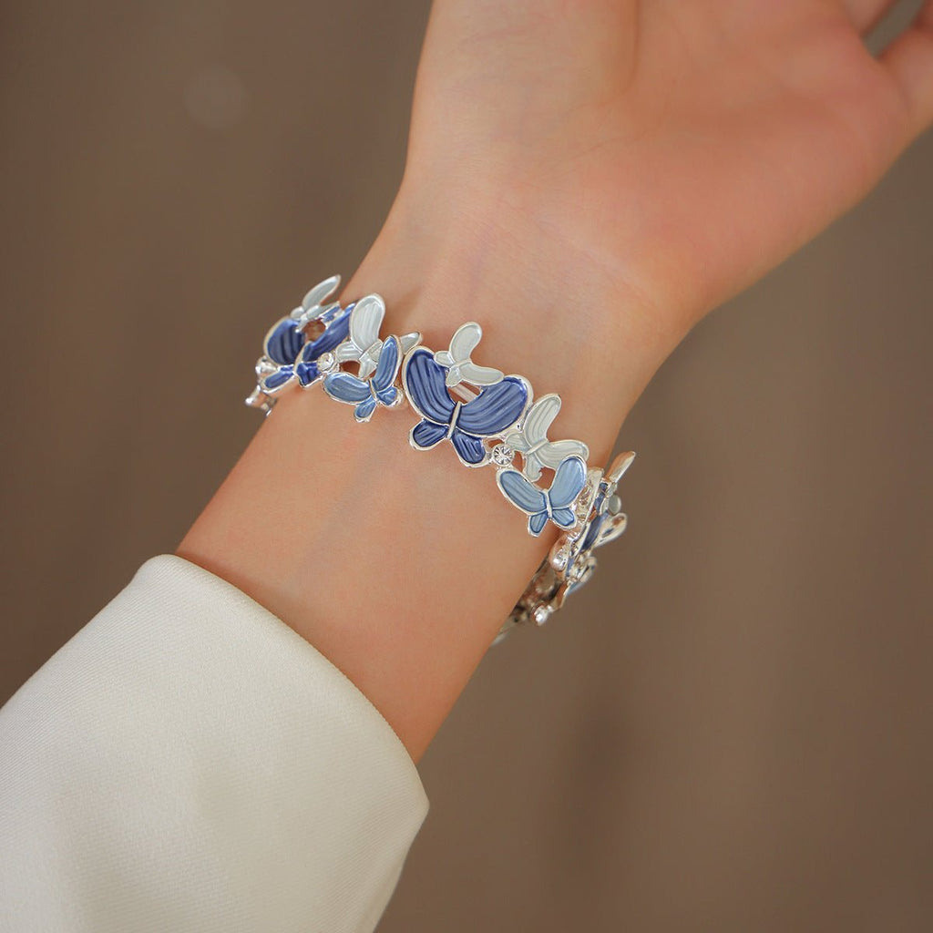 Correa Apple Watch con motivo de mariposas esmaltadas, malla elástica con strass, modelo Marjorie