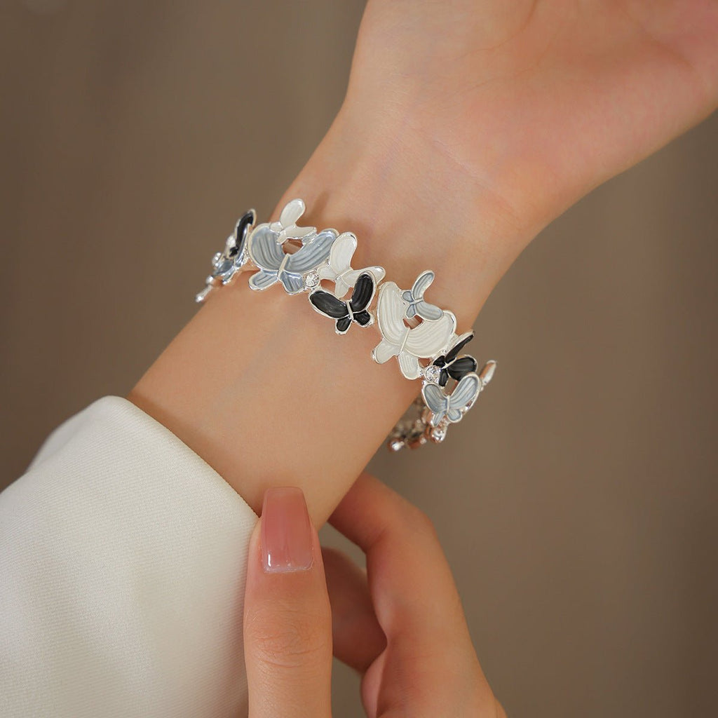 Correa Apple Watch con motivo de mariposas esmaltadas, malla elástica con strass, modelo Marjorie