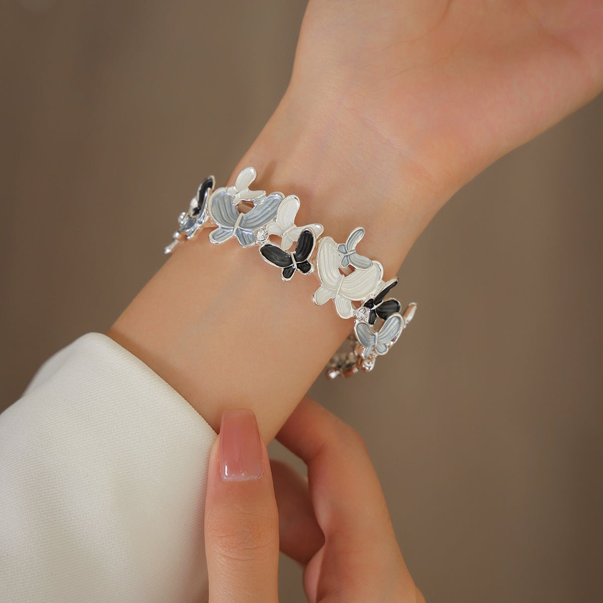 Correa Apple Watch con motivo de mariposas esmaltadas, malla elástica con strass, modelo Marjorie