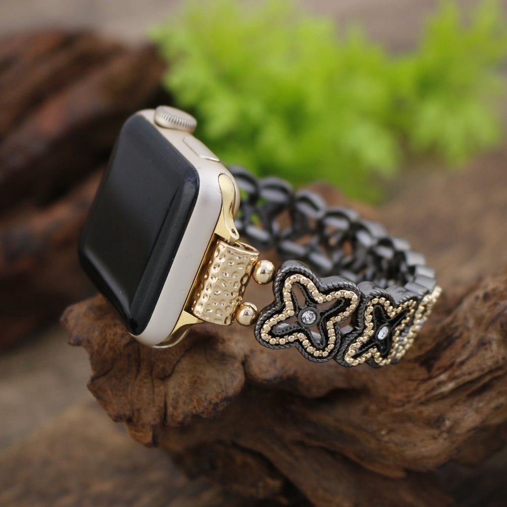 Correa Apple Watch de malla floral calada, pedrería y acabado bicolor, modelo Harpie