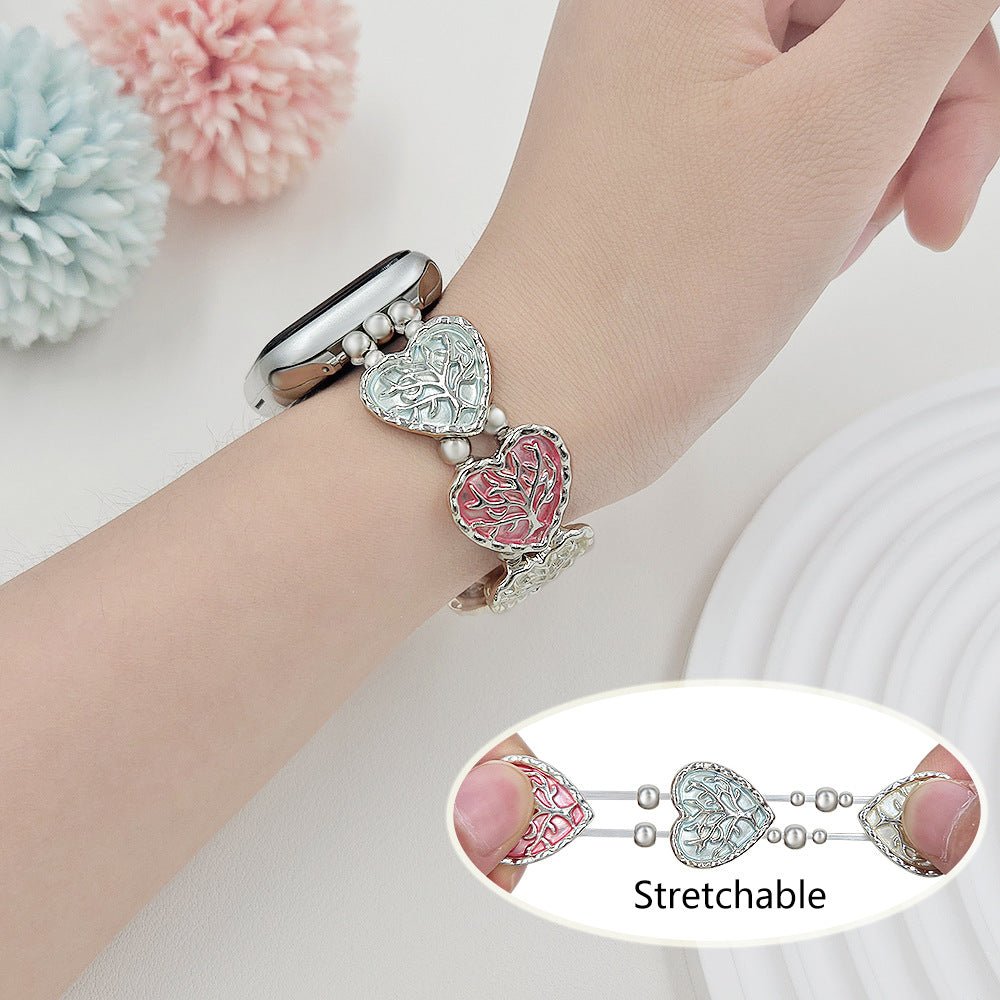 Correa elástica Apple Watch, eslabones de corazón esmaltados con motivo árbol de la vida, modelo Cabra