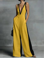 Women's wide-leg jumpsuit with V-neck and contrast trim.