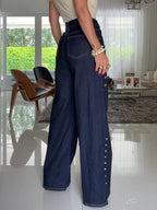 High-waisted wide-leg jeans with silver buttons and contrast stitching