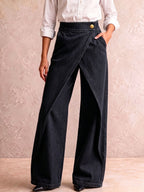Vida högmidjade jeans med asymmetrisk knäppning
