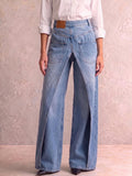 Vida jeans med hög midja och öppen V-skärning i midjan