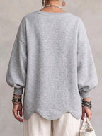 Oversized sweatshirt med vågig nederkant och puffärmar